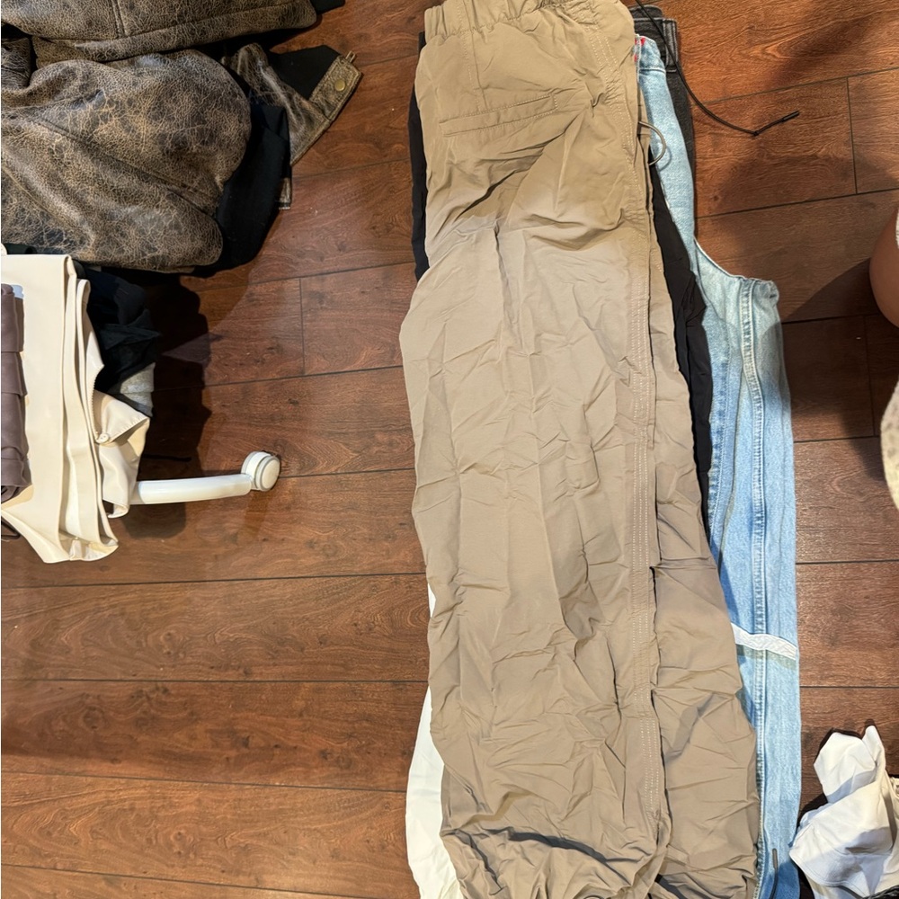 7 pairs of pants (jeans and parachute)